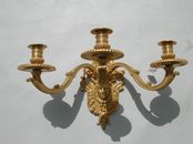 Pair of Louis XIV style ormolu sconces with masks