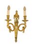 A pair of ormolu aries head Louis XVI style sconces