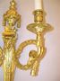 A pair of ormolu aries head Louis XVI style sconces