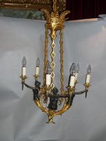 A giltbronze and dark bronze caryatides chandelier
