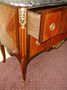 A rosewood transition chest of drawers