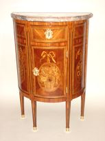 A Louis XVI half moon shaped chest of drawers