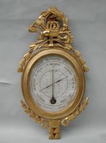 A giltwood barometer