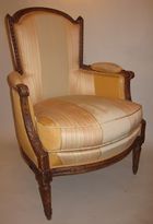 A Louis XVI natural wood bergere armchair 